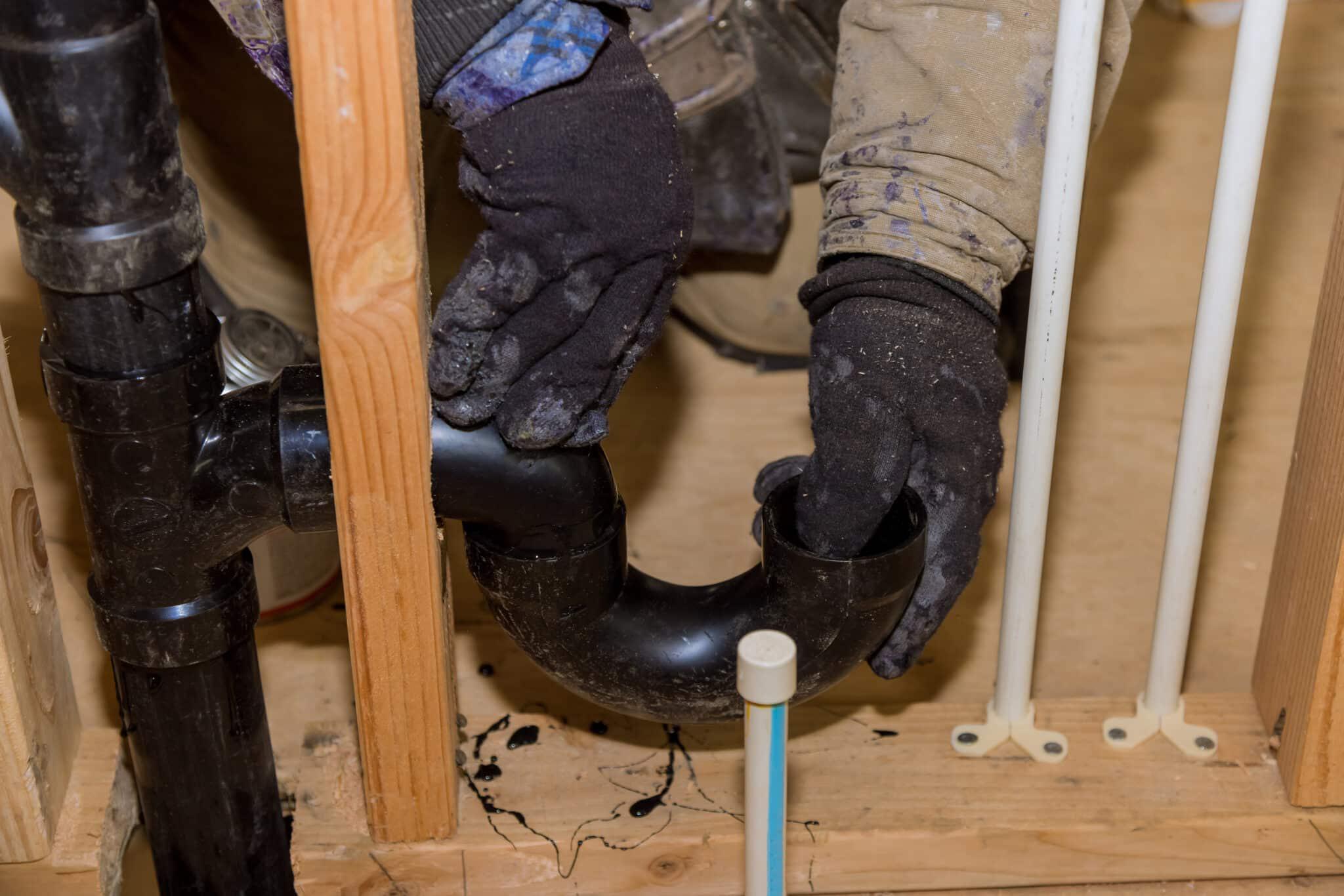 plumber working on p trap