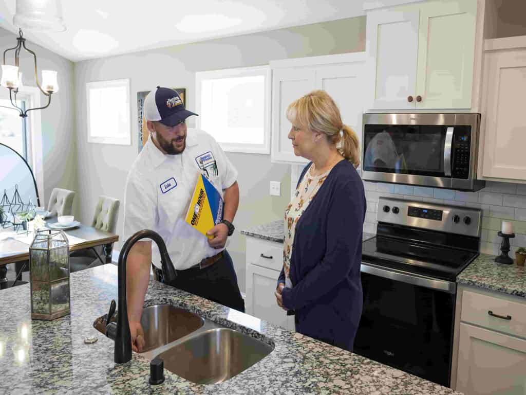 nashville-plumber-speaking-to-customer-about-sink