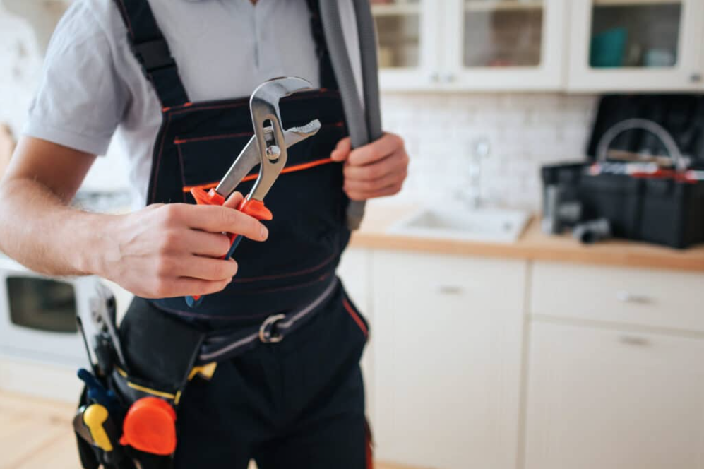 plumber holding wrench