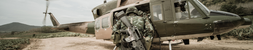 military getting into helicopter