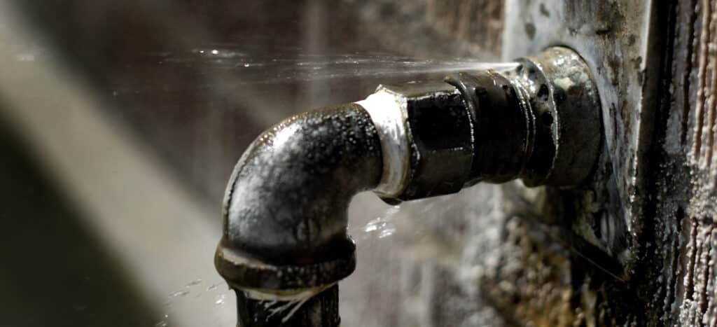 burst pipe spraying water